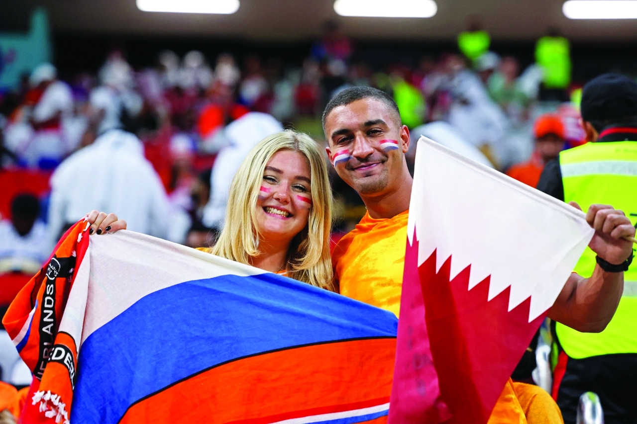 "Fans attend the Qatar 2022 World Cup Group A football match between the Netherlands and Qatar at the Al-Bayt Stadium in Al Khor, north of Doha on November 29, 2022. (Photo by KARIM JAAFAR / AFP)"