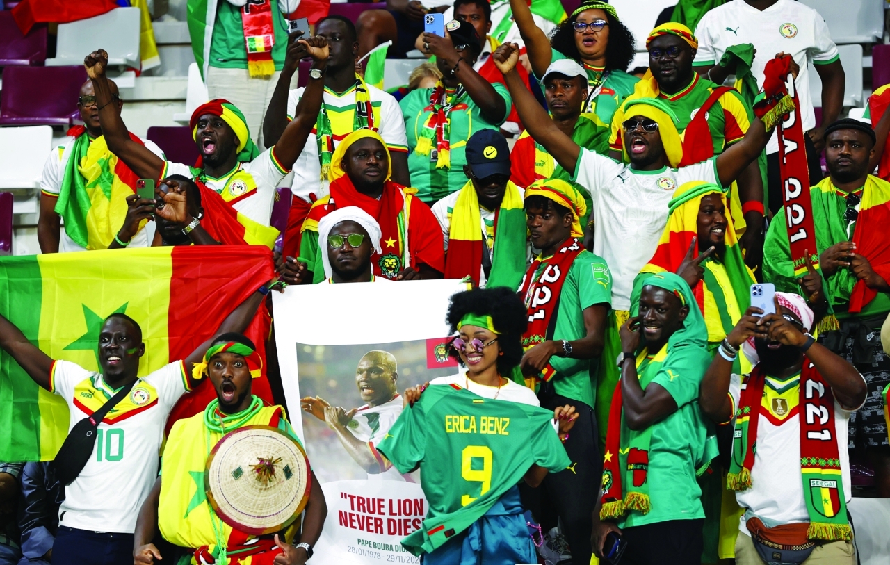 "epa10336377 Fans of Senegal prior the FIFA World Cup 2022 group A soccer match between Ecuador and Senegal at Khalifa International Stadium in Doha, Qatar, 29 November 2022.  EPA/Rolex dela Pena"