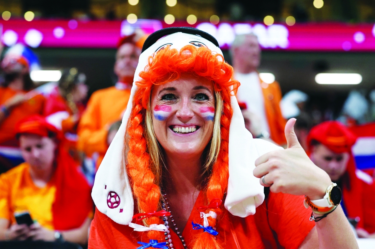 "Fans attend the Qatar 2022 World Cup Group A football match between the Netherlands and Qatar at the Al-Bayt Stadium in Al Khor, north of Doha on November 29, 2022. (Photo by KARIM JAAFAR / AFP)"